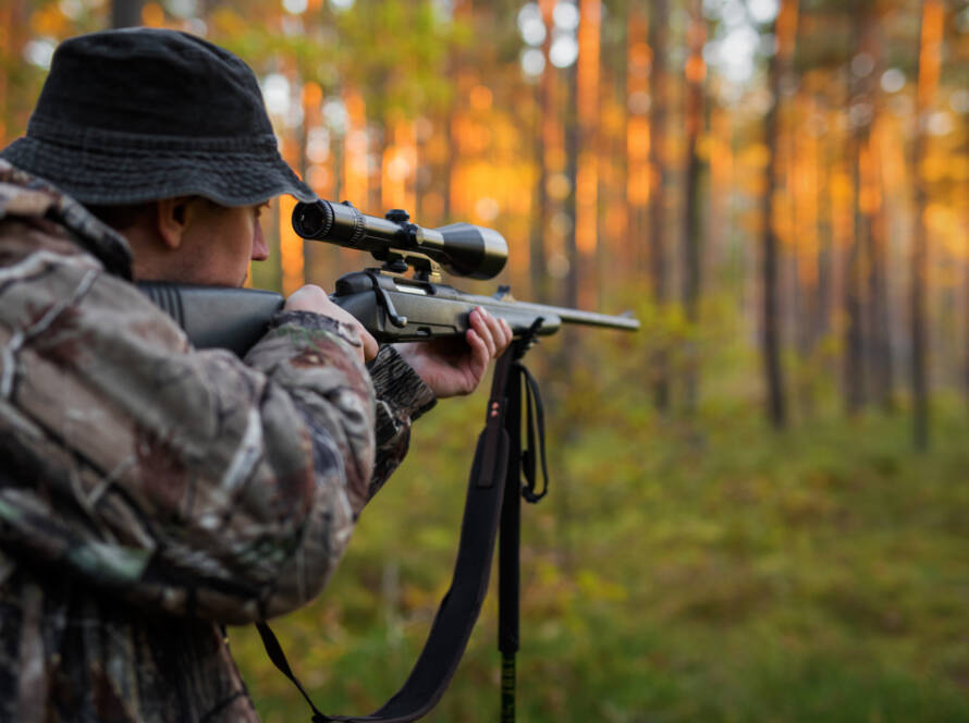 picture of man looking through optics